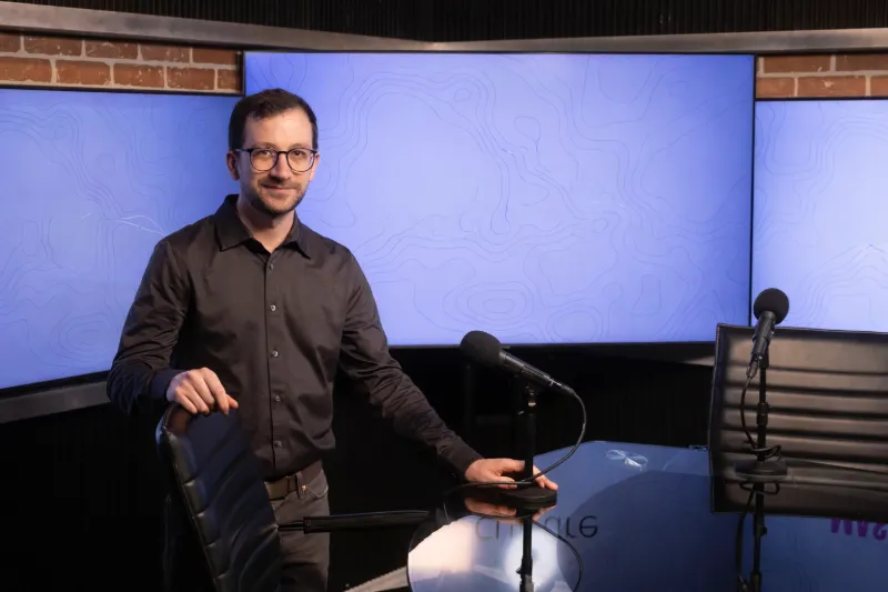 Michael Morreale on a podcast studio set with microphones